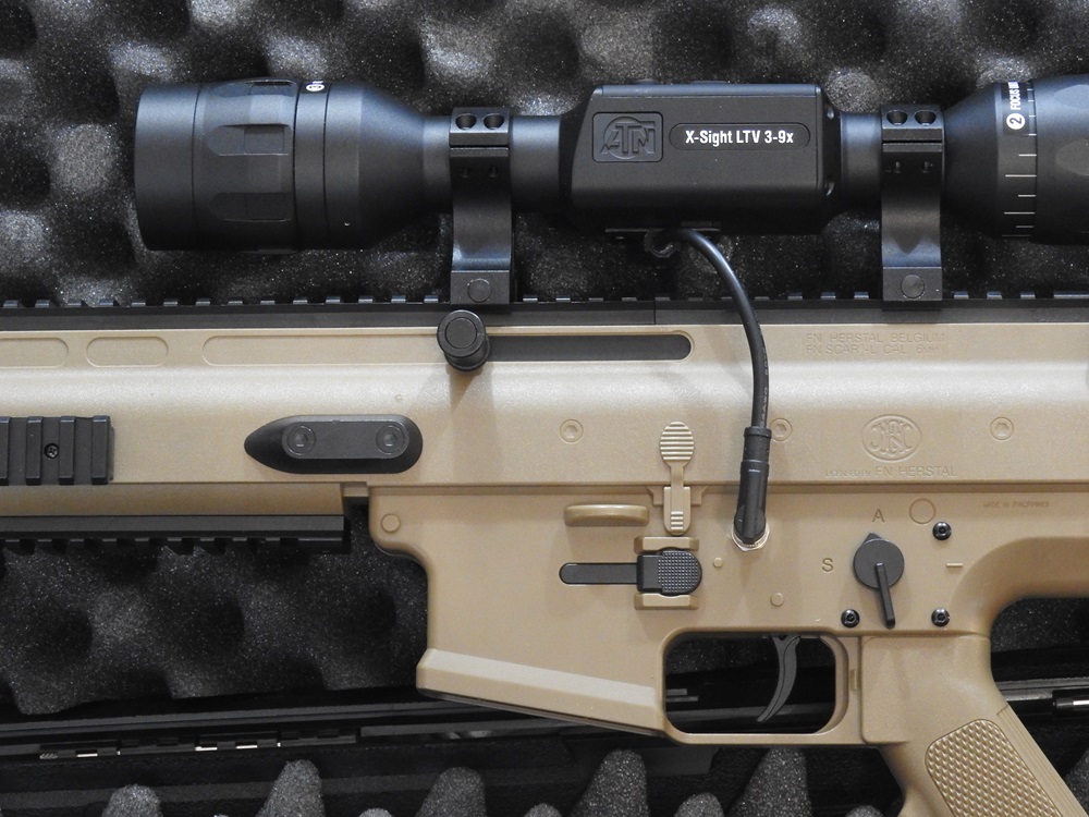 ATN X-Sight LTV 3-9x scope modified to take photos shown attached to #D printed hunting rifle in case.